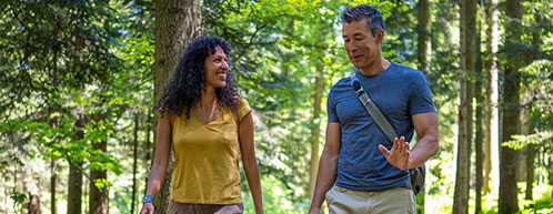 Couple Hiking In Forest